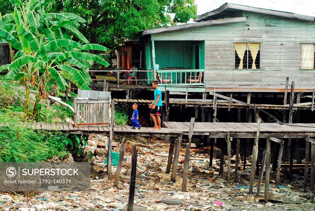 Malaysia, Borneo, Sabah State, Semporna, houses on stilt with poluted water and garbage underneath