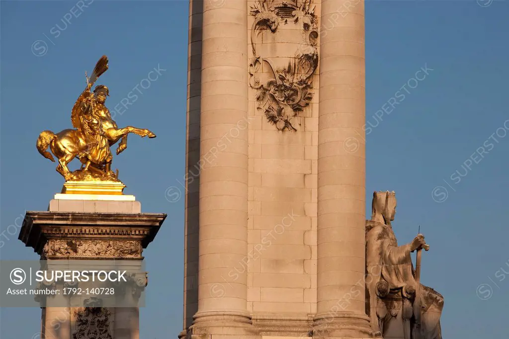 France, Paris, Pont Alexandre III, angle pillars covered with a golden bronze statue representing Pegasus held by La Renommee Arts allegory