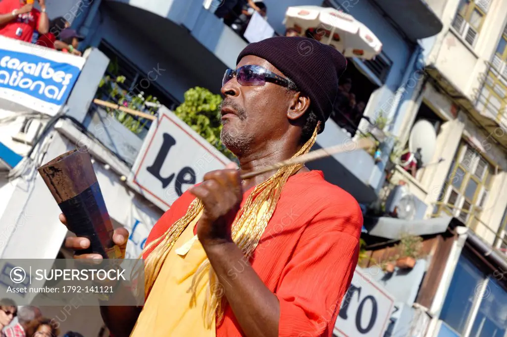 France, Martinique French West Indies, Fort de France, percussionist tapping a horn during carnival