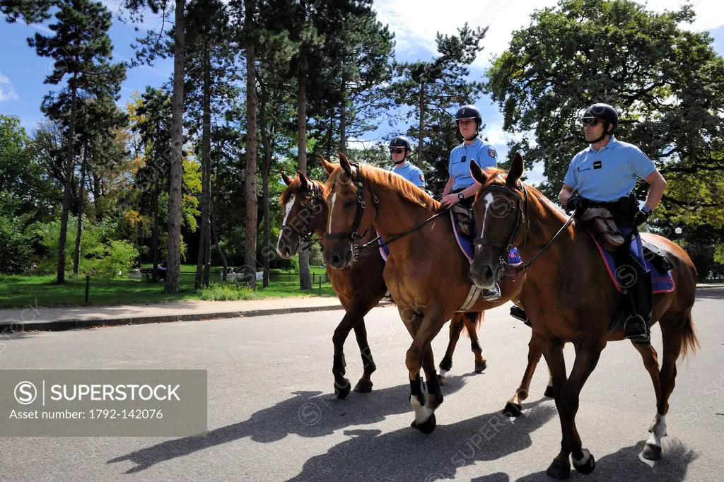 France, Paris, Republican Guardmen patrolling on horseback in the Bois de Boulogne