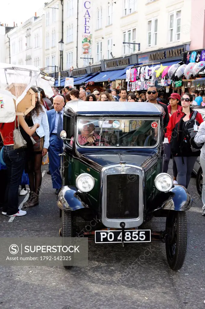 United Kingdom, London, Portobello Road market, old English car in the crowd
