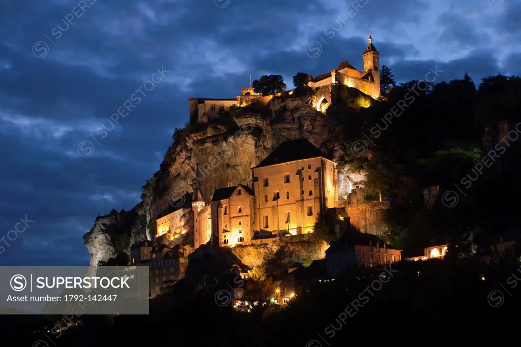 France, Lot, Rocamadour, the hilltop village and the city and its religious shrines dominated by the castle, night view