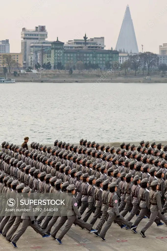 North Korea, Pyongyang, Juche tower esplanade, squad of female teenagers in military uniforms rehearsing for a parade