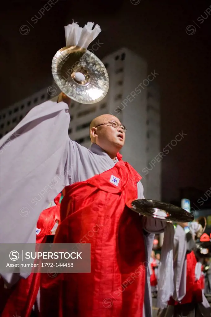 South Korea, Seoul, Jongno District, Lantern Festival Parade, Korean monk singing and playing the cymbals