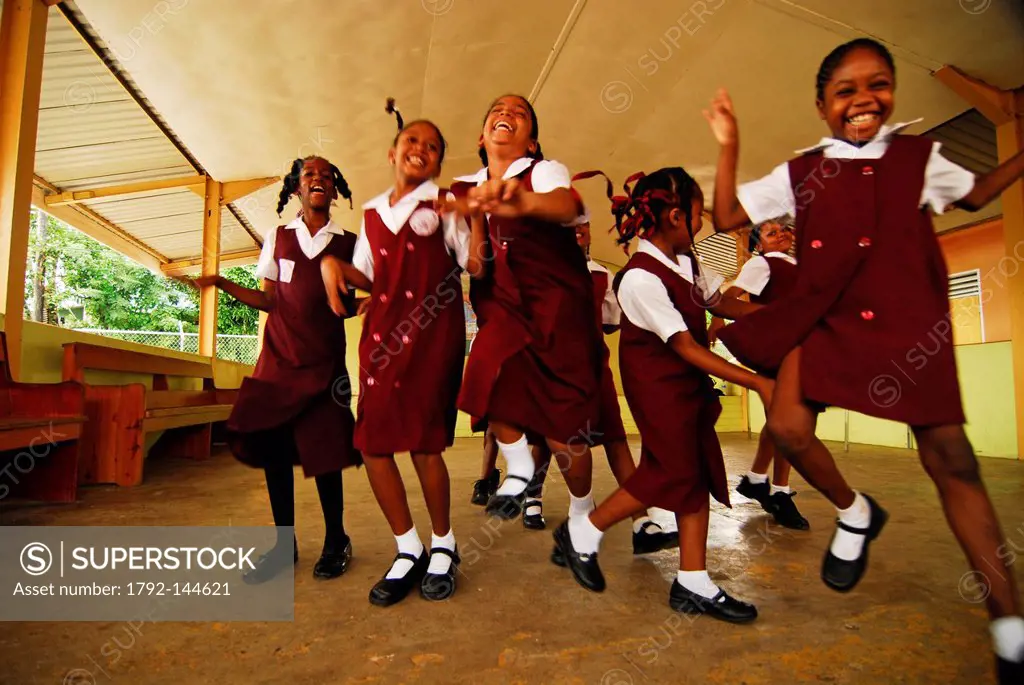 West Indies Caribbean, Saint Lucia, Castries, low angle view of cheerful schoolgirls smiling