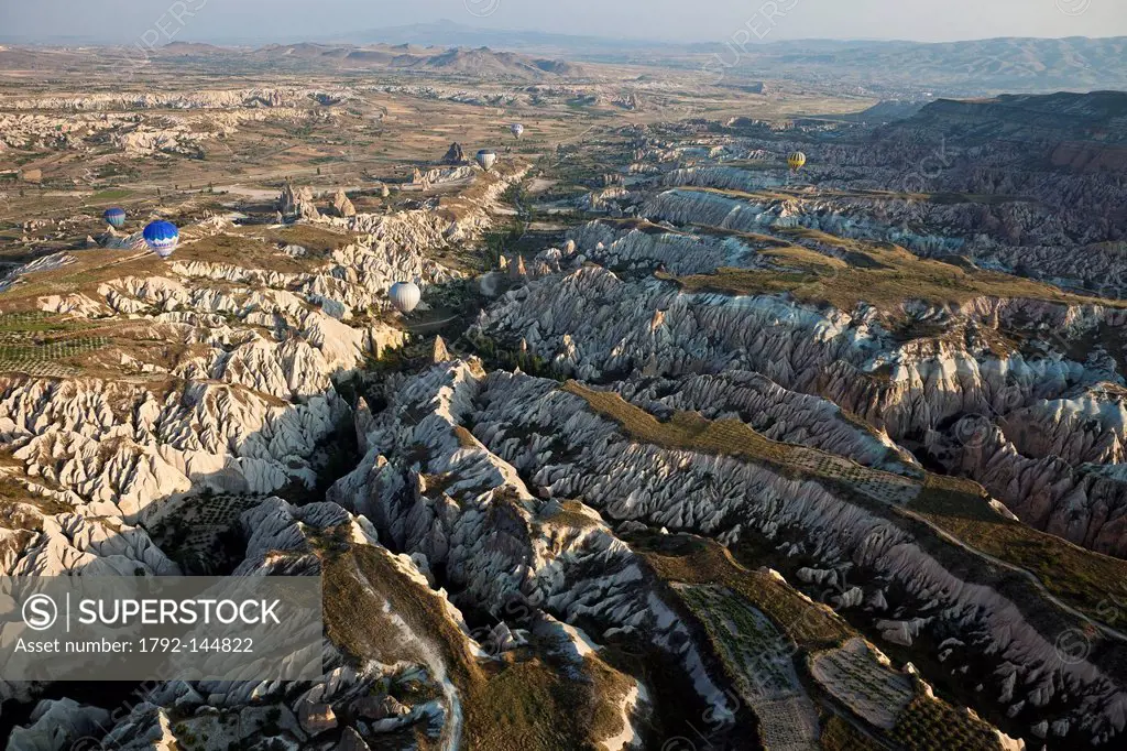 Turkey, Central Anatolia, Cappadocia, listed as World Heritage by UNESCO, Goreme valley, hot air balloons aerial view