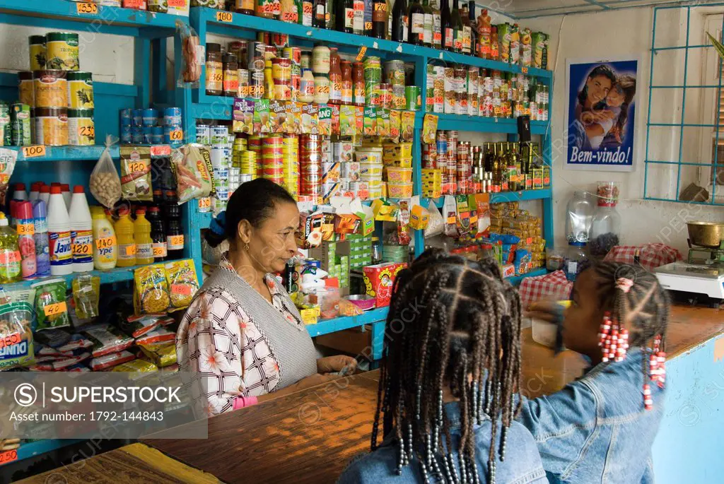 Cape Verde, Sal island, Palmeira, old woman and two girls in a grocer´s shop