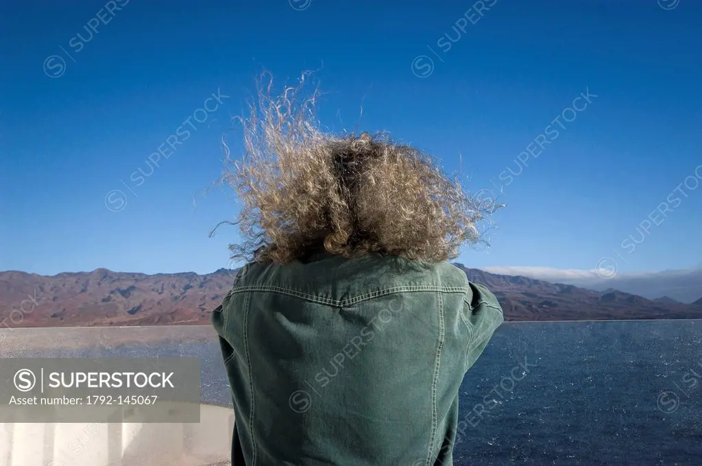 Cape Verde, Santo Antao island, a man the hair in the wind during the crossing in ferry between the island of Sao Vicente and the island of Santo Anta...