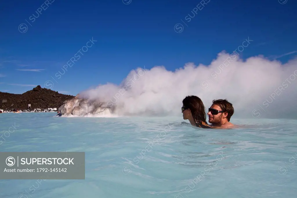 Iceland, Sudurnes region, Grindavik, Blue Lagoon, couple of swimmer in a lagoon of warm water has 39 stemming from the natural geothermal activity and...