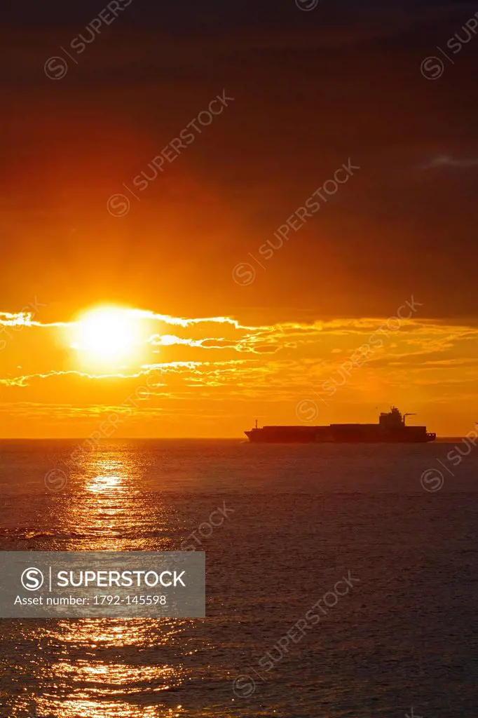 Canada, Quebec Province, Manicouagan, Les Bergeronnes, Cap de Bon Desir, passage of a container ship at sunrise