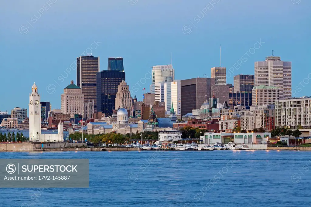 Canada, Quebec Province, Montreal, the city from the St. Lawrence River at night during sunrise, the Clock Tower, Old Montreal, the downtonwn skyscrap...