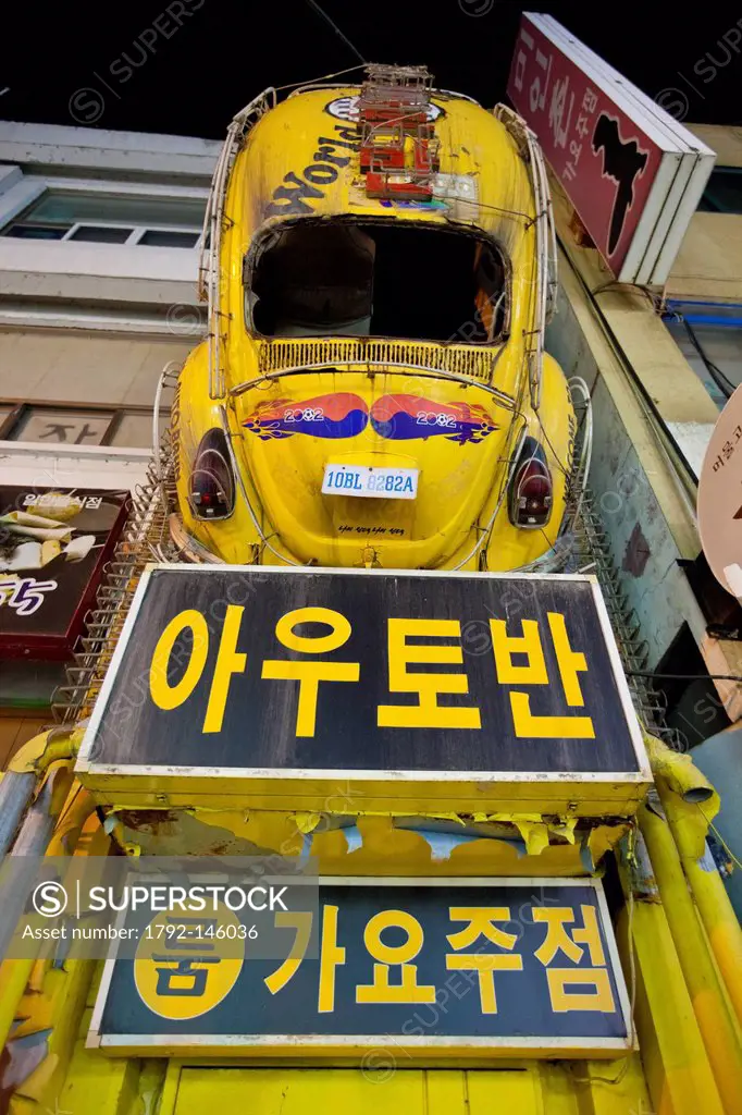 South Korea, North Chungcheong Province, Chungju, entrance to a cafe and bodywork of a Volkswagen Beetle ornating the wall