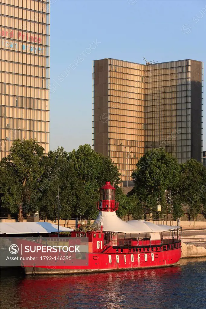 France, Paris, the Quai Francois Mauriac, the Bibliotheque Nationale de France BNF by architect Dominique Perrault and the Batofar, boat converted int...