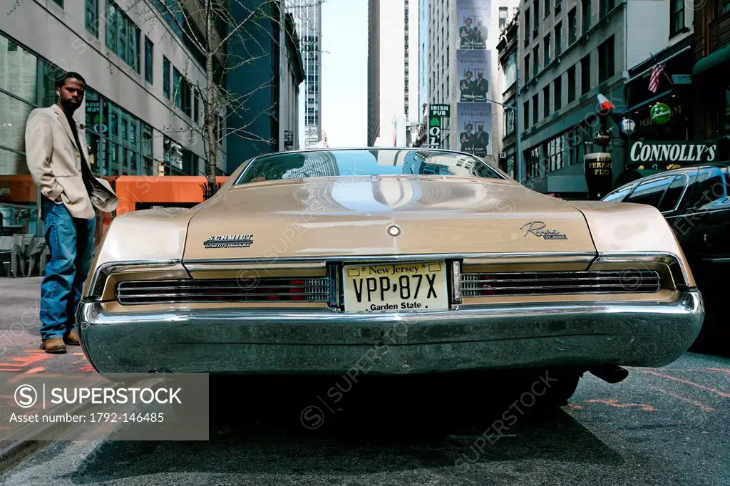 United States, New York City, Manhattan, new yorker close to a old Buick