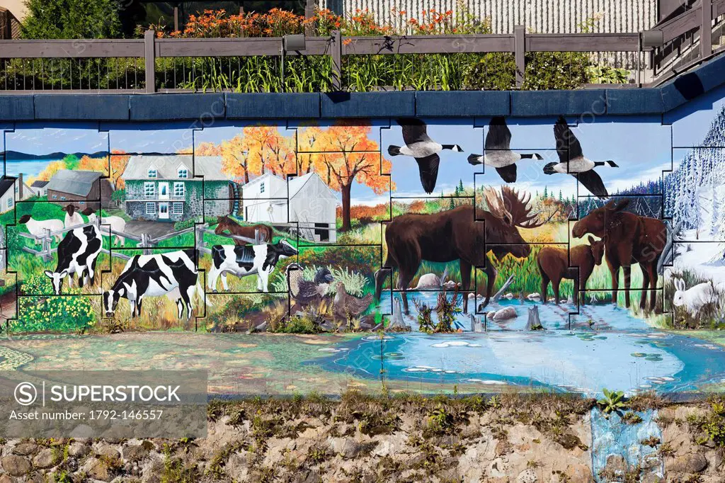 Canada, Quebec province, Charlevoix region, St Lawrence river raod, Baie St Paul, the church and the mural depicting the history of the region and its...