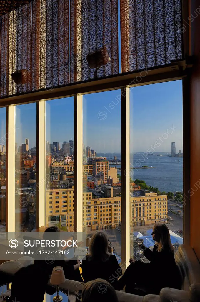 United States, New York, Manhattan, Meatpacking District, champagne at the bar from the Standart Hotel build over the High Line, overlooking Downtown,...
