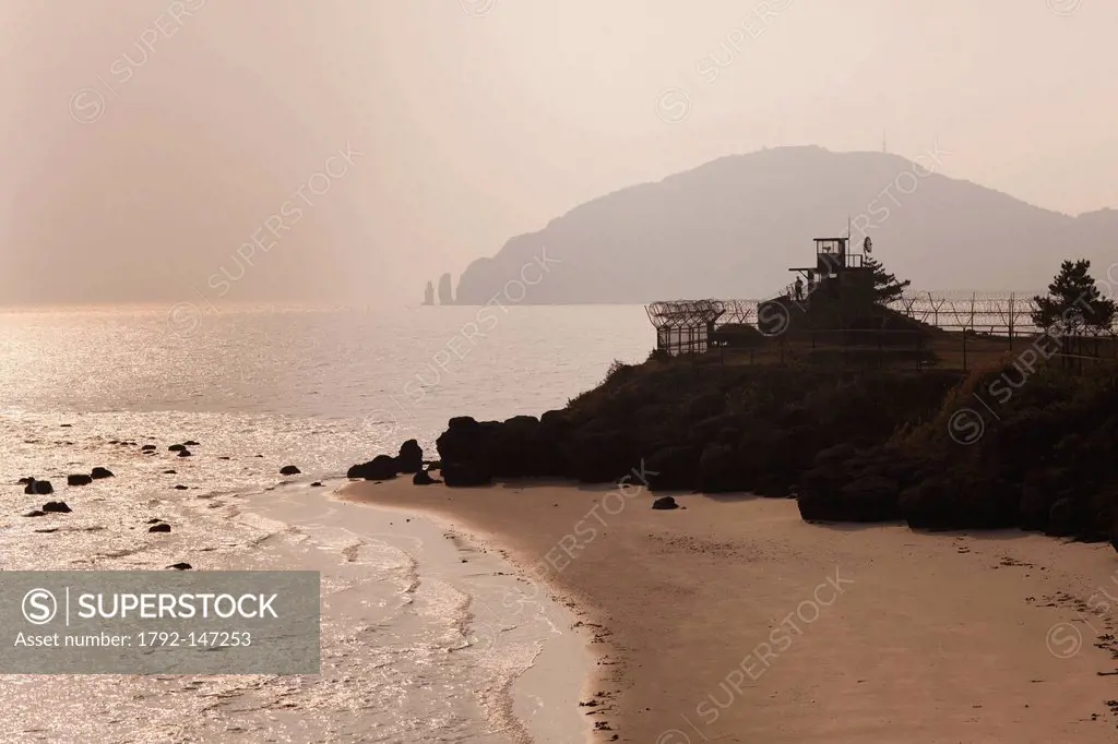 South Korea, Incheon, Ongjin County, Baengnyeong Island, South Korean coast guard watching the sea. The island is near the Northern Limit Line, which ...