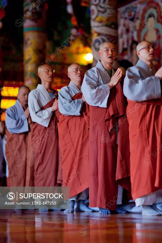 South Korea, North Chungcheong Province, Chungju, Seokjong Buddhist Temple, procession of praying monks