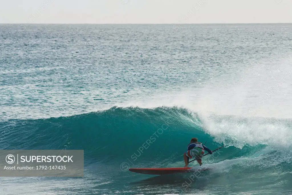 Cape Verde, Sal island, Ponta Preta, man on a longboard