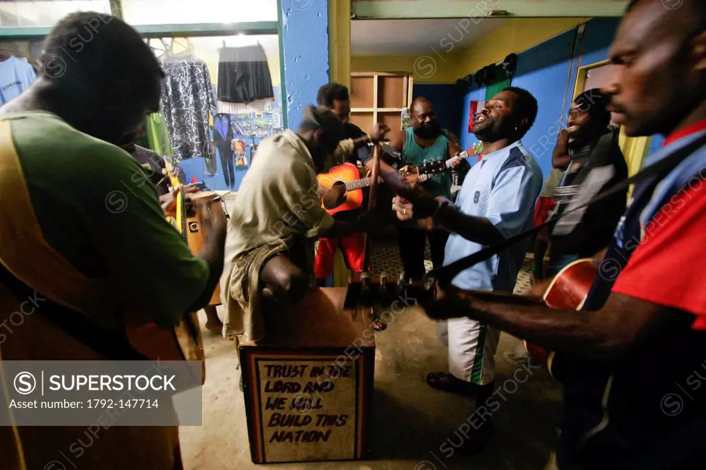 Vanuatu, Sanma Province, Espiritu Santo Island, Luganville, group of musicians singing Christian prayers