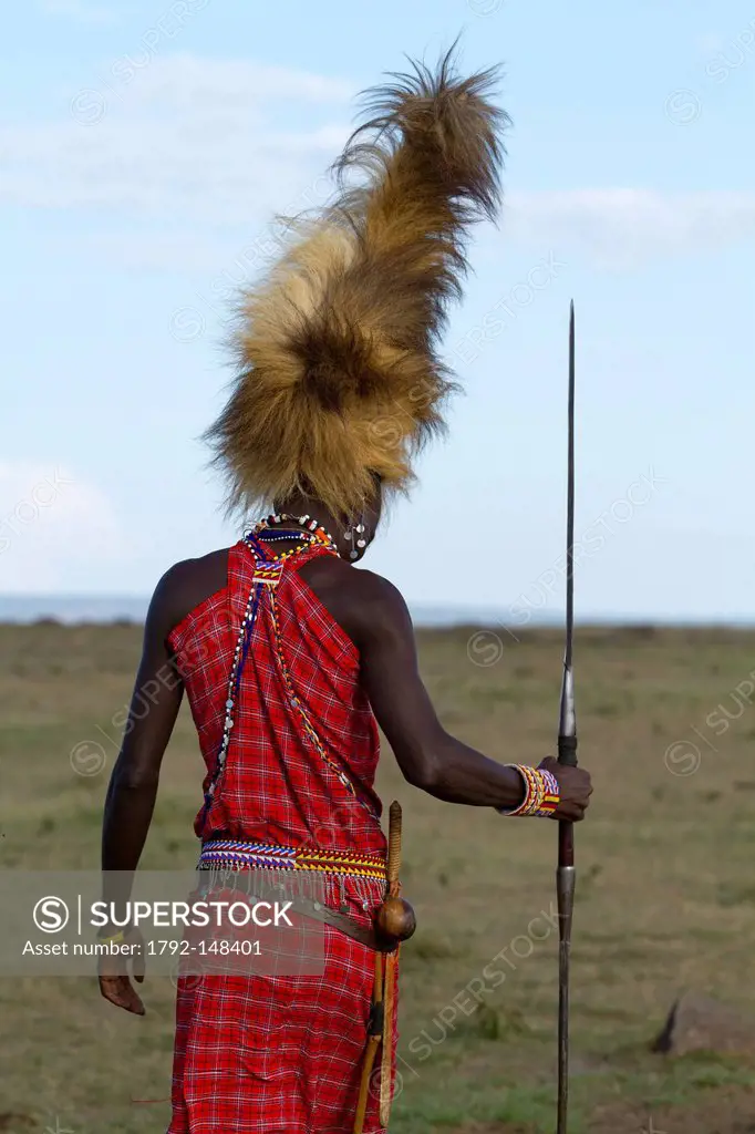 Kenya, Masai Mara Game Reserve, Masai warrior with lion cap