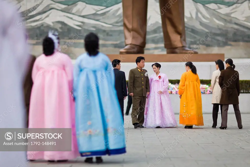 North Korea, Pyongyang, Mansudae monument, young married couples paying respect to Kim Il_Sung giant bronze statue