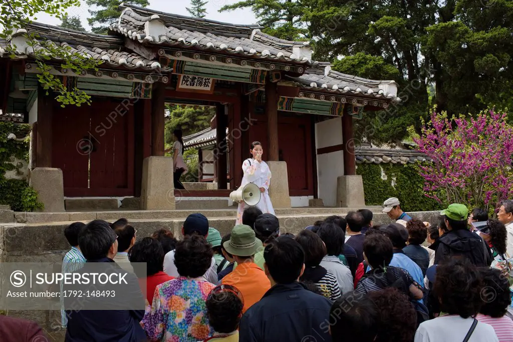 North Korea, North Hwanghae province, Kaesong, South Korean tourists and North Korean guide in front of the gate to a tourist site