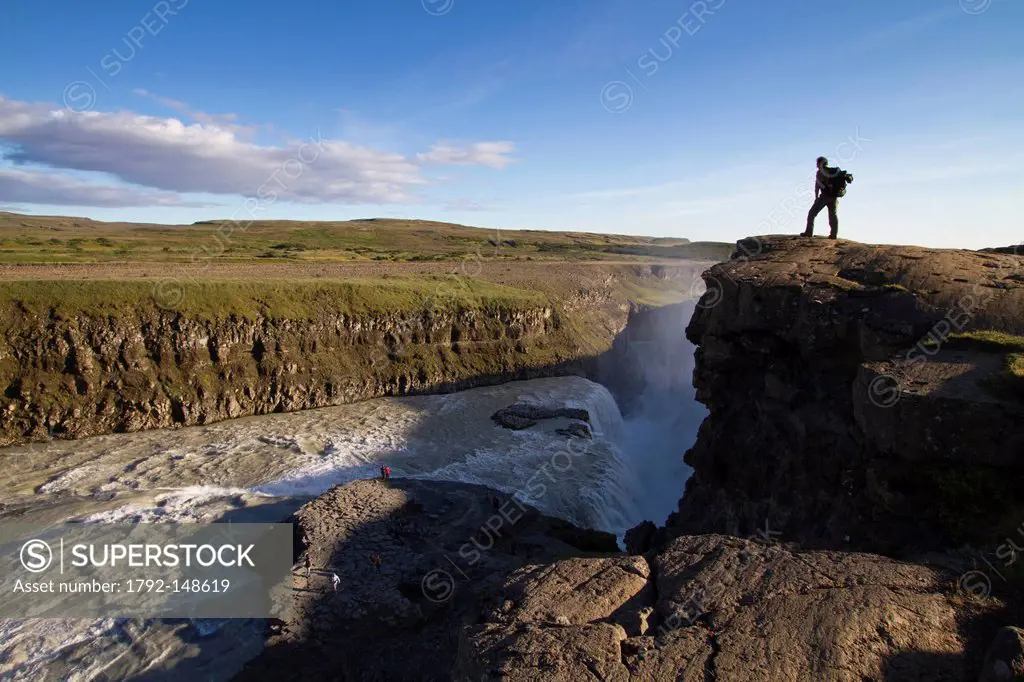 Iceland, Vesturland region, tourist over the waterfalls of Gullfoss