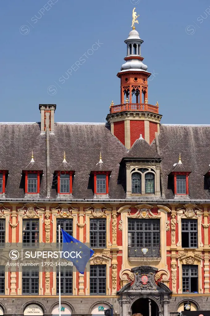 France, Nord, Lille, European flag in front of the old stock exchange and the lilies flower and lions of Flanders