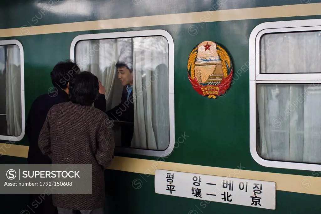 North Korea, Pyongyang, Railway station, passenger staying saying goodbye to his family staying on the platform