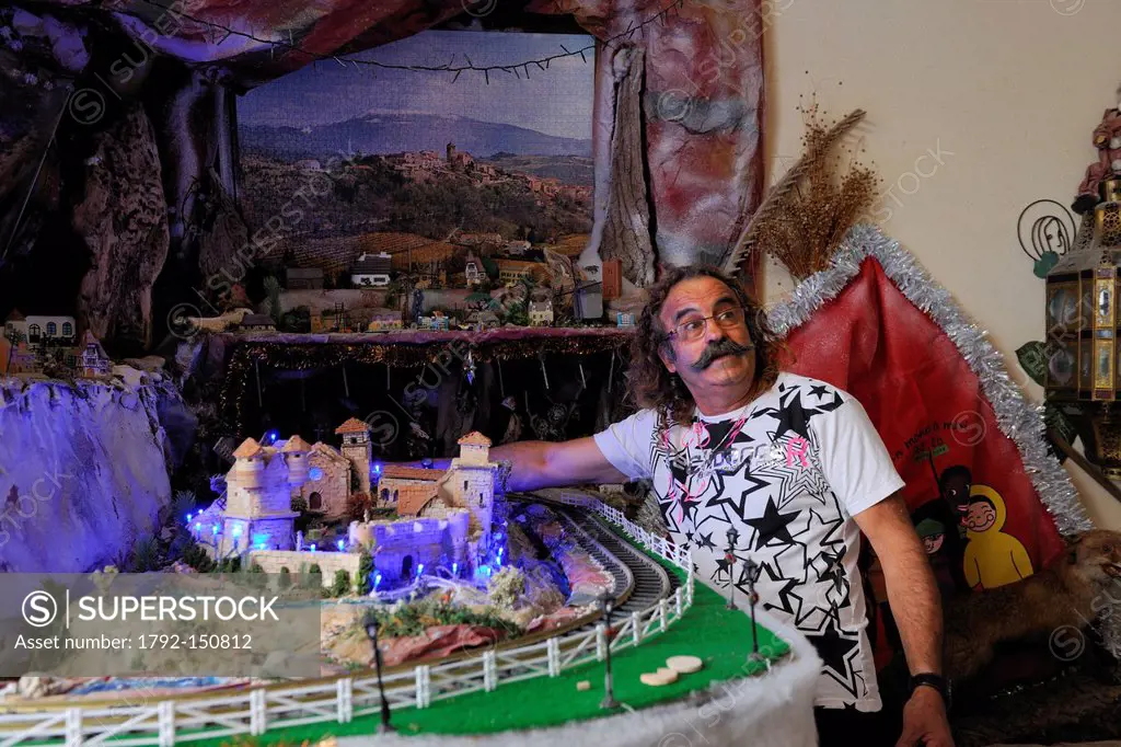 France, Herault, Beziers, Mr Azzopardi beside his models in his home in Rue du chapeau rouge