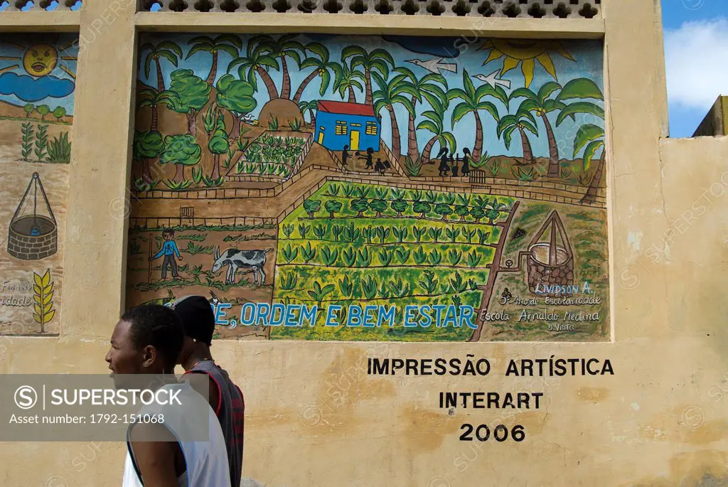 Cape Verde, Sao Vicente island, Mindelo, two men walking past a mural painting
