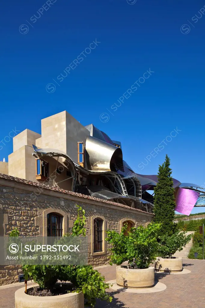 Spain, Spanish Basque Country, Alava Province, Rioja Alavesa, Elciego, wine cellars with Hotel Marques de Riscal designed by architect Frank Owen Gehr...