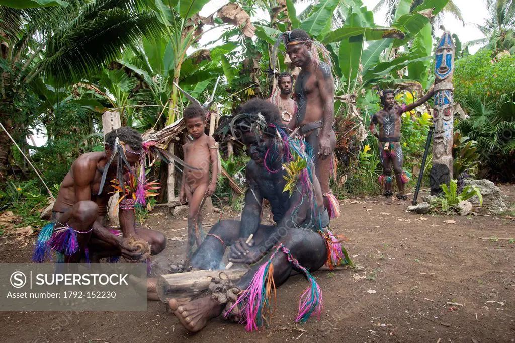 Vanuatu, Malampa Province, Malekula Island, Gortiengser, Small Namba shaman making fire by rubbing two wooden elements, fire plow technique