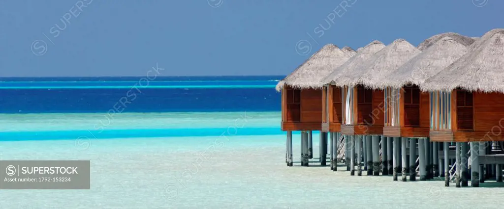 Maldives, South Male Atoll, Dhigu Island, Anantara Resort and Spa Hotel, bungalows on stilts in a turquoise lagoon