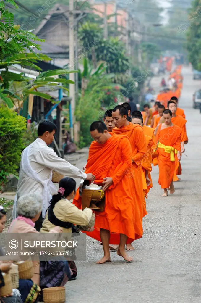 Laos, Luang Prabang Province, Luang Prabang City, during the procession of Tak Bat Ceremony for offerings made to the monks every morning at sunrise