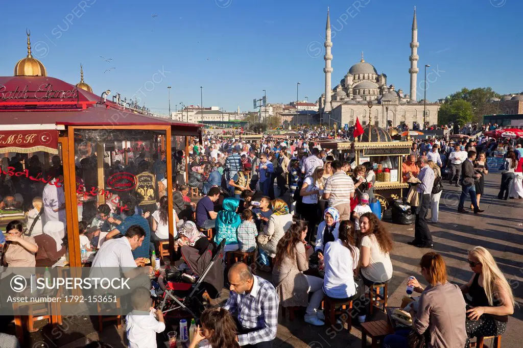 Turkey, Istanbul, historical centre listed as World Heritage by UNESCO, Eminn district, fish restaurants on boats and the Yeni Cami New Mosque in the ...