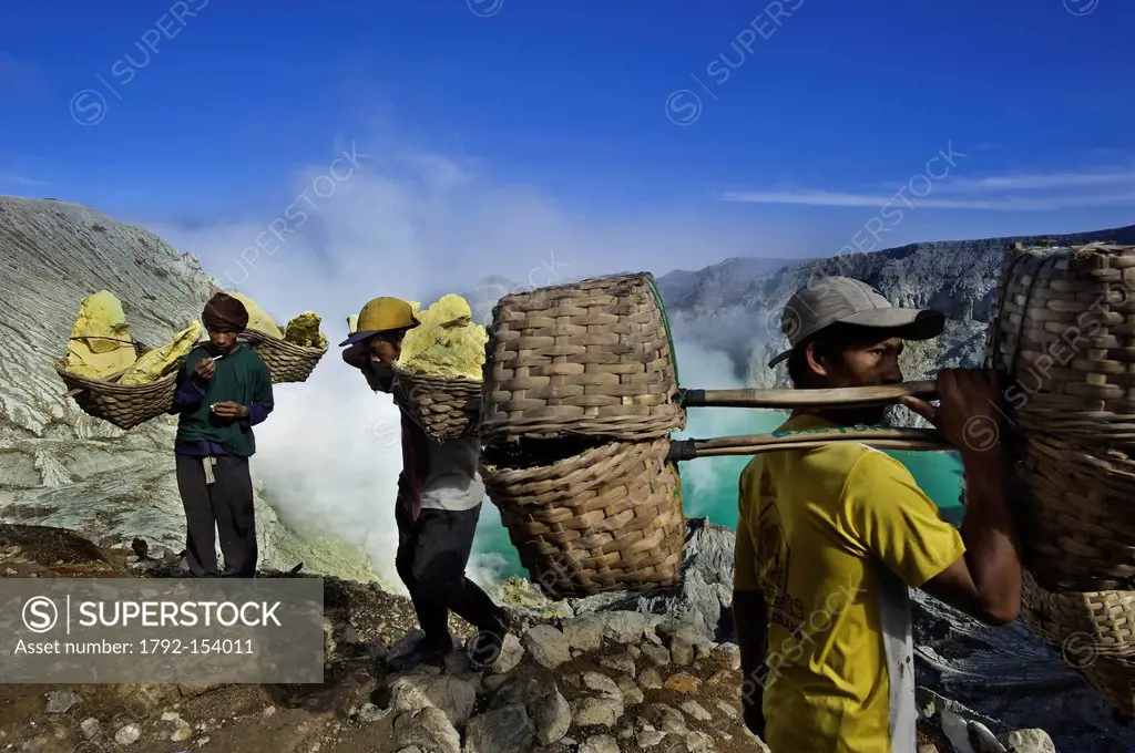 Indonesia, Java, East Java Province, Mining Sulfur by hand in Kawah Ijen volcano 2500m, the carrier Roknat bringing back 70kg of sufur from the heart ...