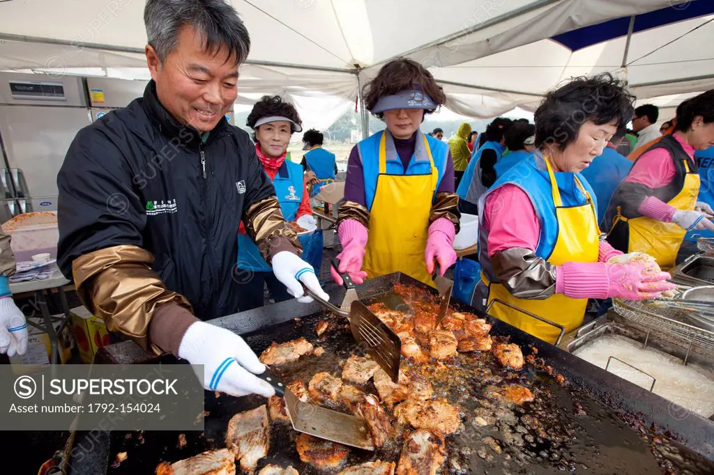 South Korea, Gangwon Province, Yangyang, preparation of fried salmon during a festival