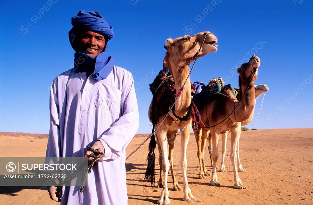 Libya, Sahara, tuareg camel rider in the Tassili of Maghidet