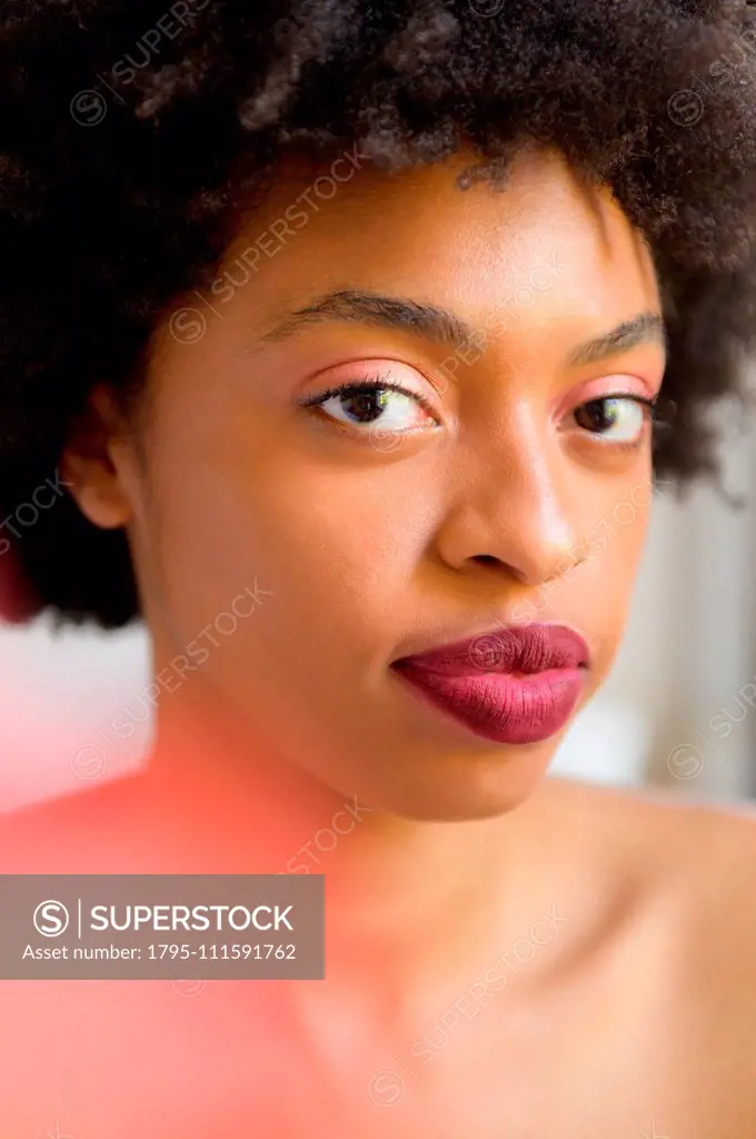 Portrait of young woman wearing lipstick