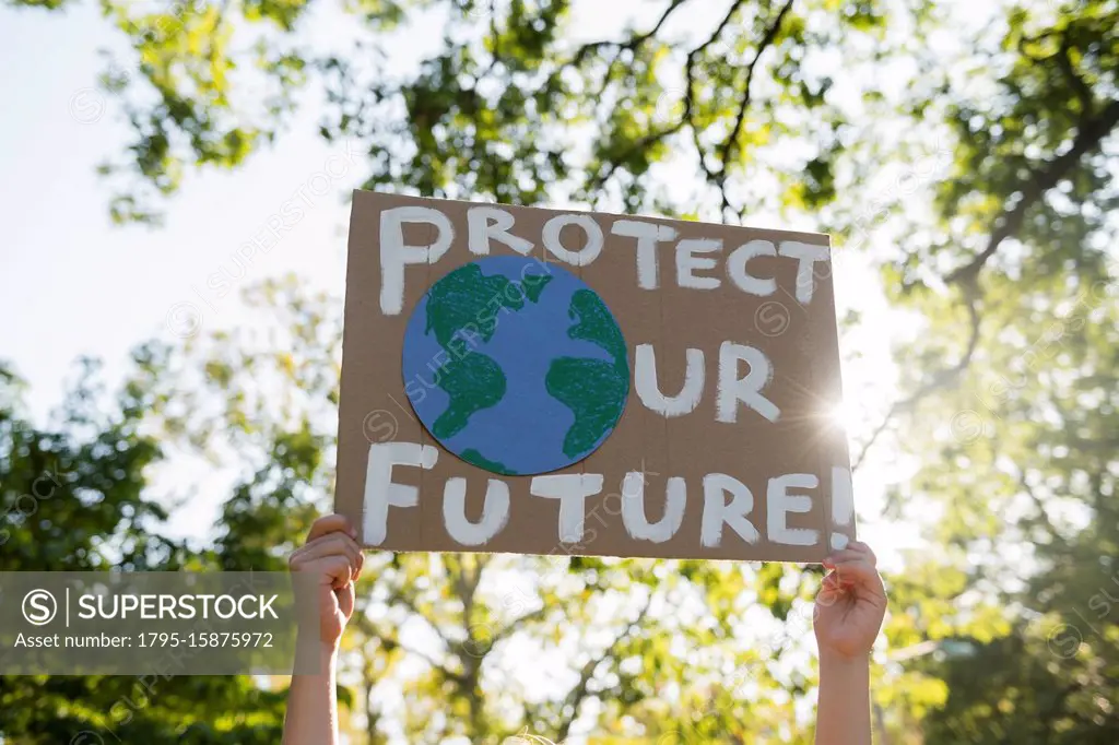 Climate change activist holding sign