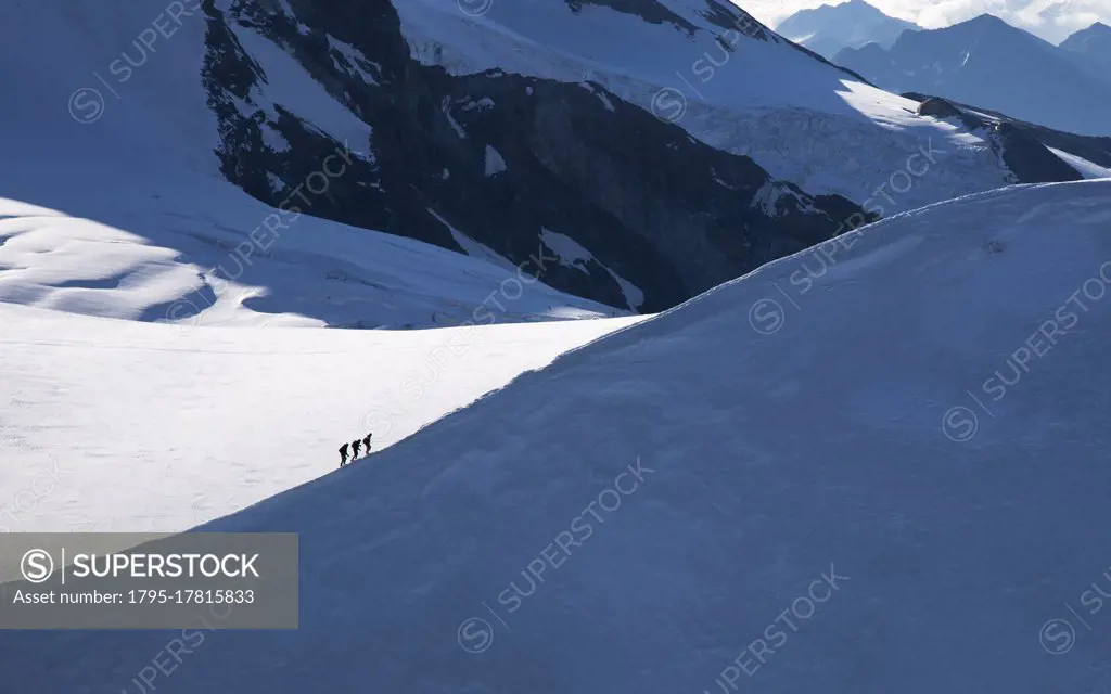 Switzerland, Monte Rosa, Climbers on mountain ridge at Monte Rosa Massif