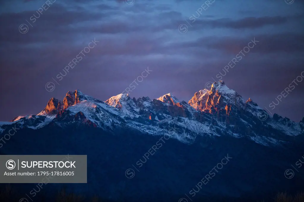 USA, Wyoming, Jackson, Grand Teton National Park, Sunset light on peaks of Teton Range in Grand Teton National Park
