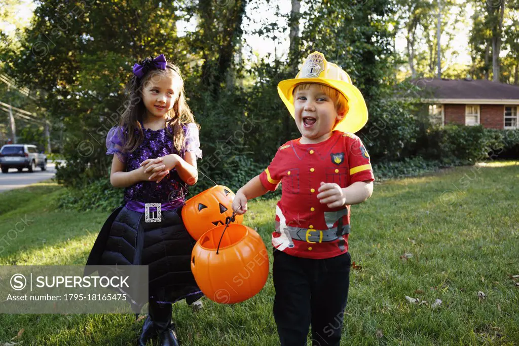 Two children trick or treating