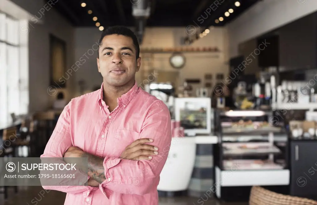 Portrait of young man in coffee shop