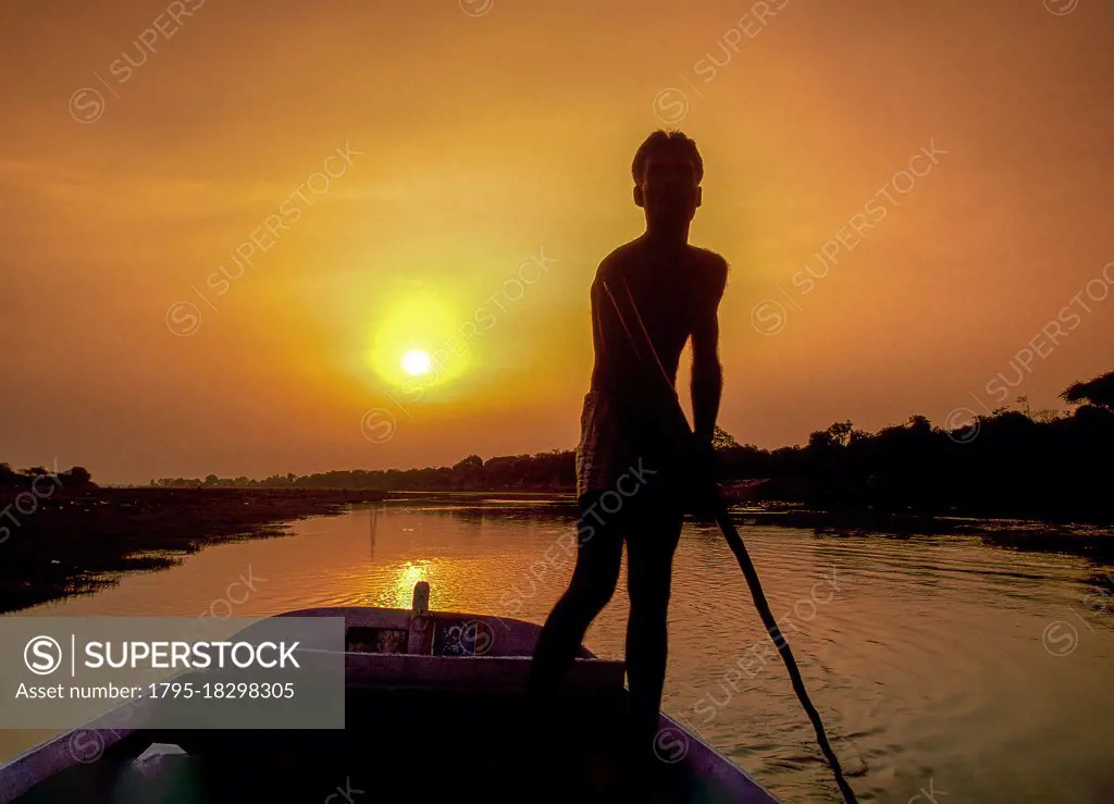 India, Agra, Boatman at sunset
