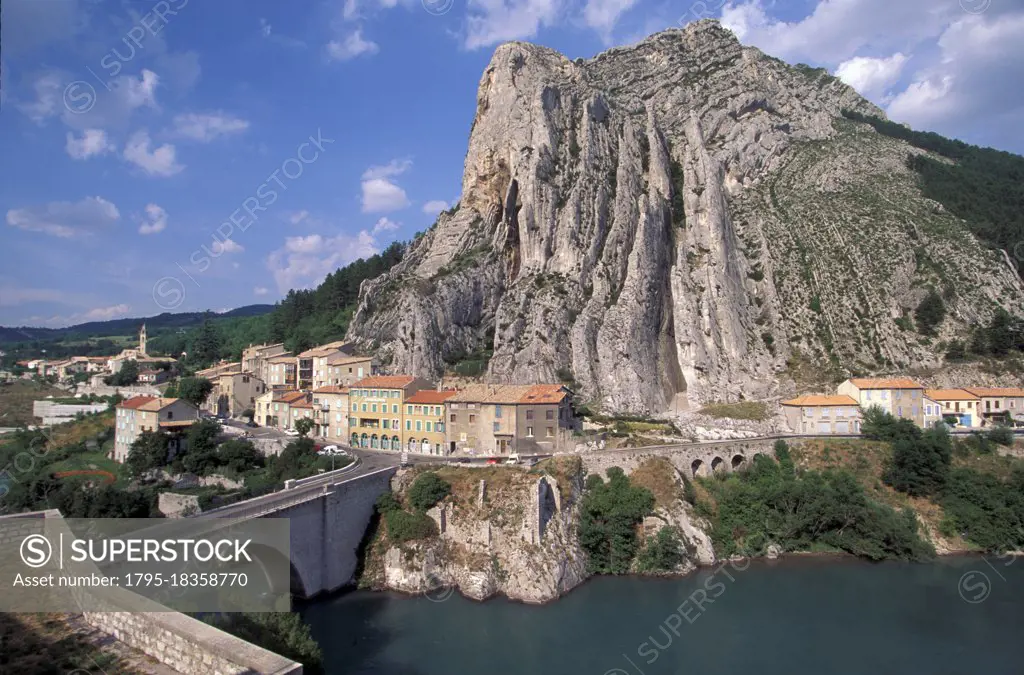 France, Provence, Sisteron, Rocher de la Baume mountain with village near Durance river