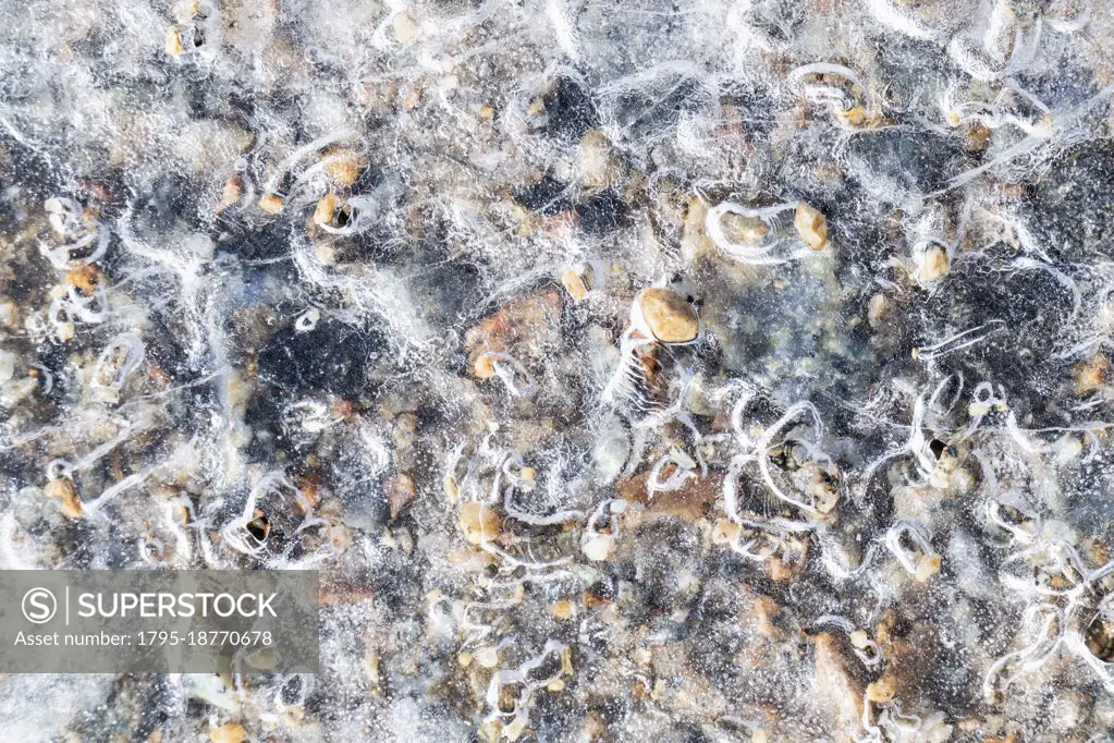 Pebbles in frozen river