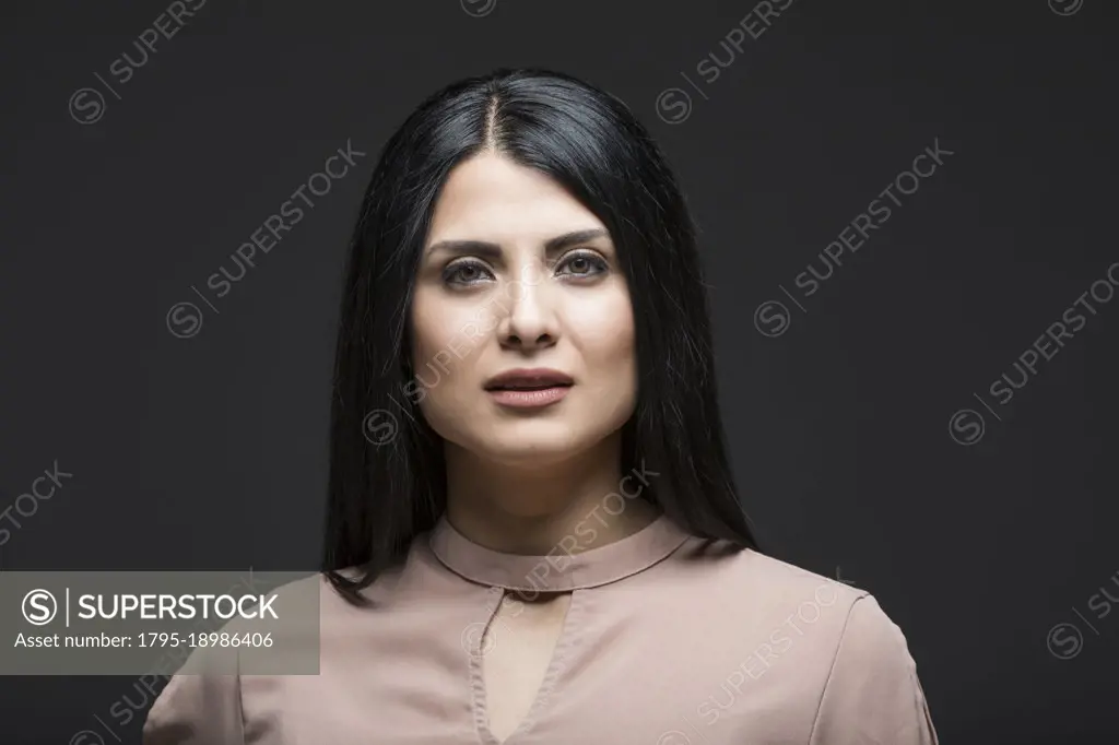Studio portrait of serious woman